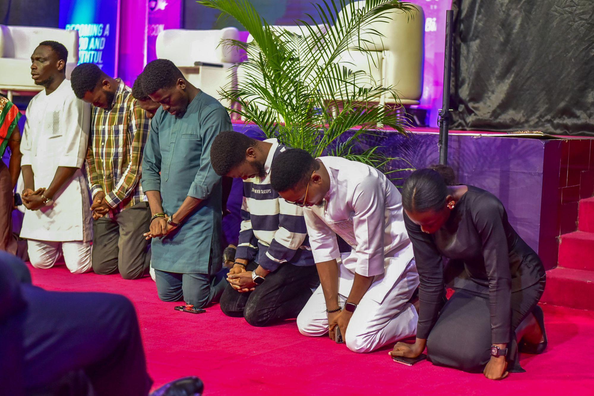 Brethren kneeling in prayer