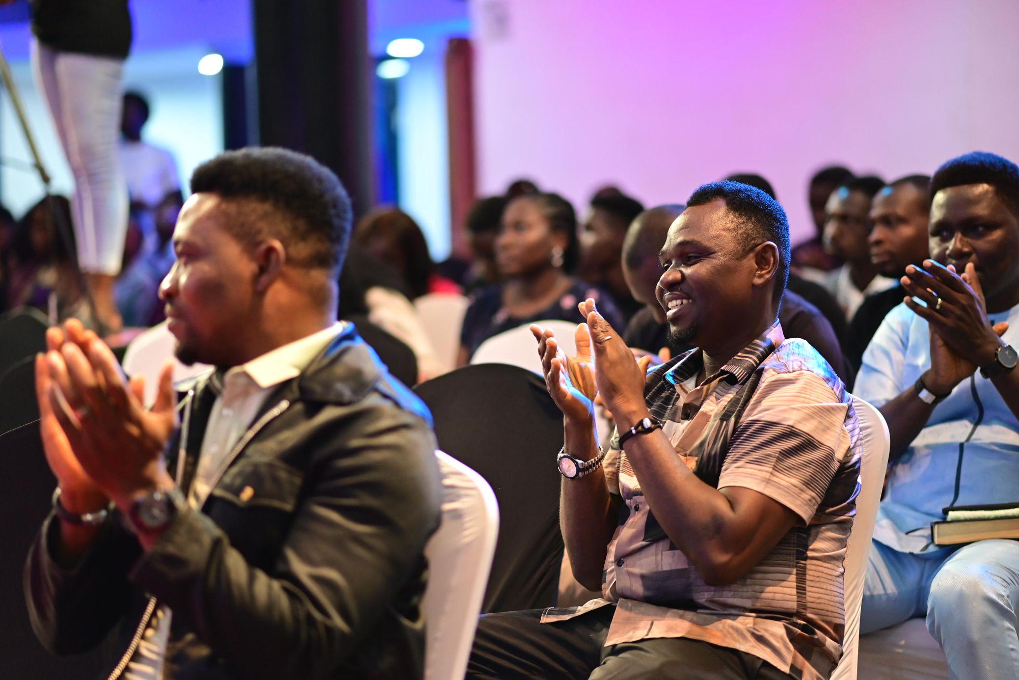Delegates applauding at a Team101 conference